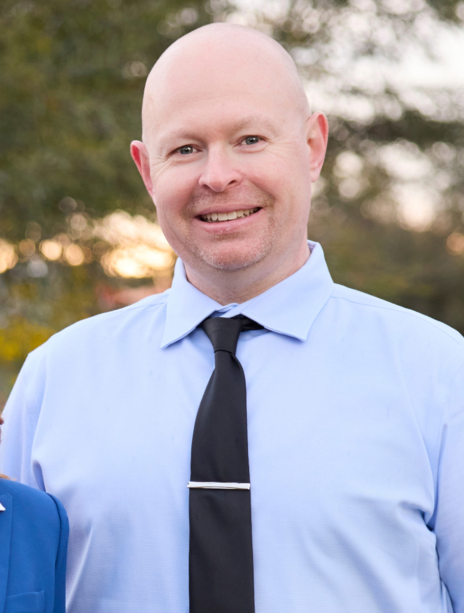 Headshot portrait of Matthew Brosius