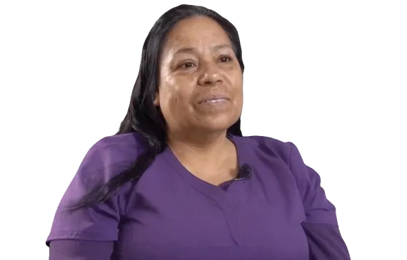 Headshot of Francisca wearing purple scrubs and smiling