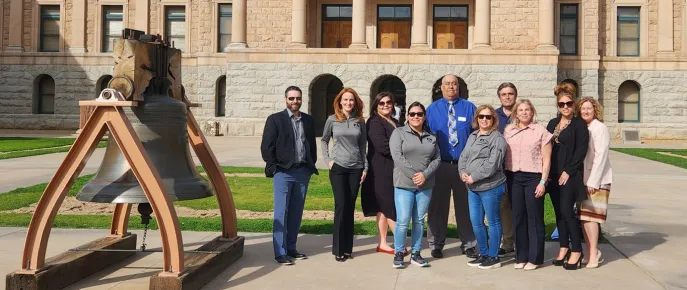 Home Assist Health team posing for a group photo outside in front of a legislator's building